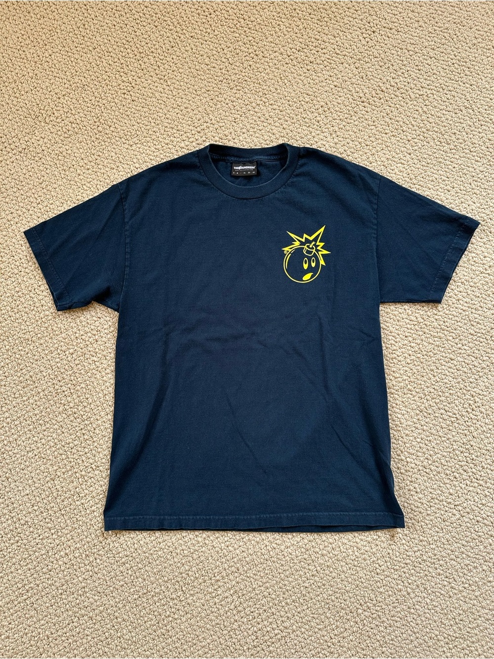 The Hundreds Navy Tee with Neon Yellow Smiley Bomb Logo